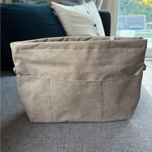 Beige handbag organizer insert with multiple pockets